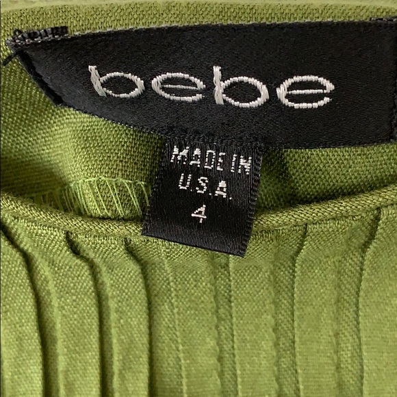 Olive green BEBE mini skirt with a flare! Size 4 - Picture 2 of 2